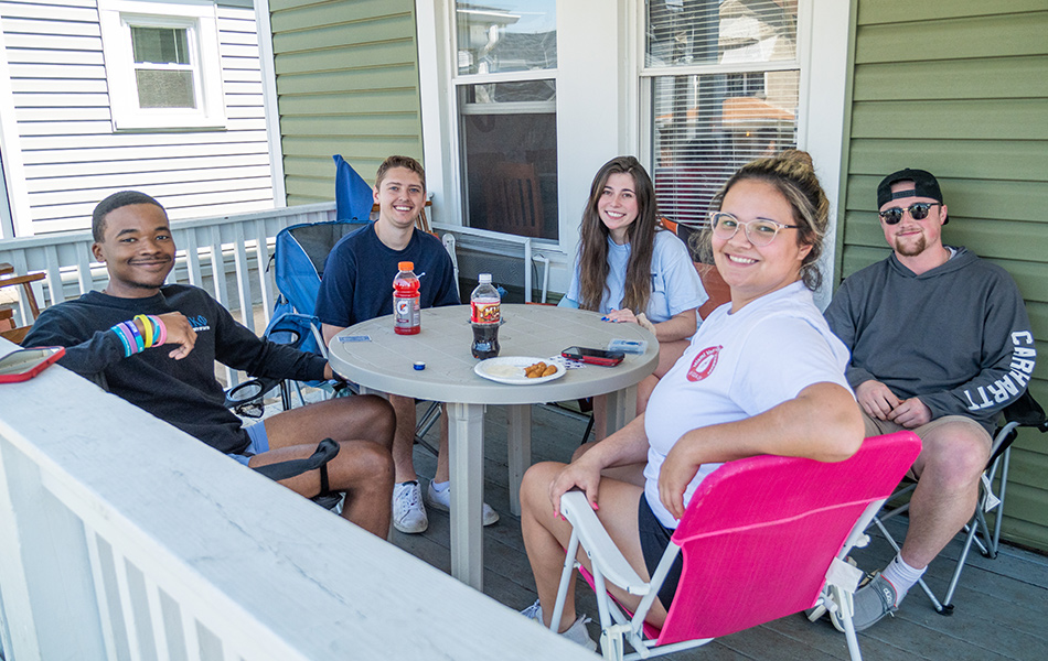 ${ Group of students on a porch }