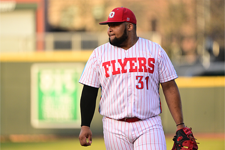 Photo of Marcos Pujols, playing in the field, on the baseball diamond, in a Flyers uniform.