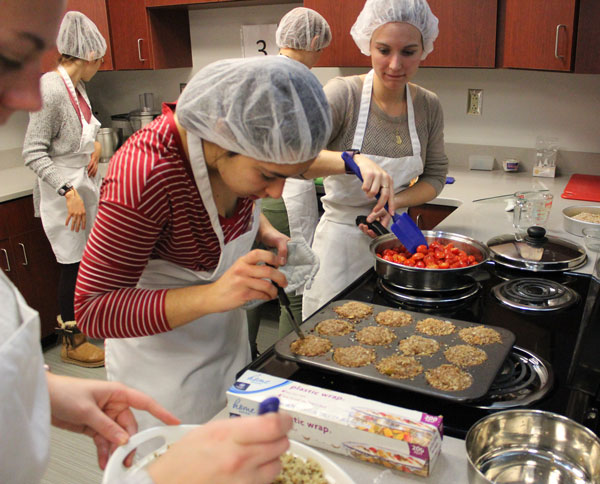 Students cooking in the food lab