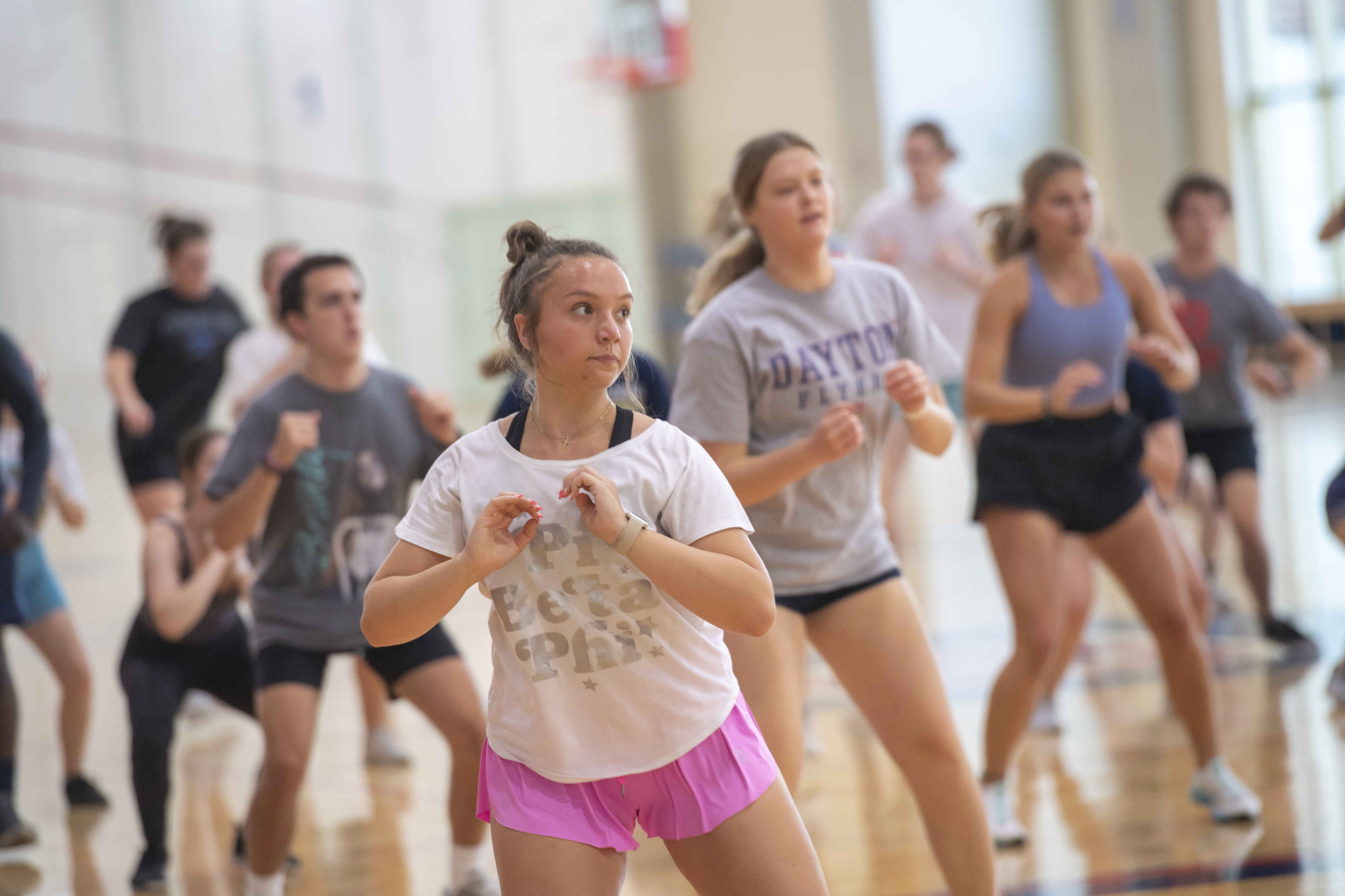 Patrons focused in a large group fitness class offered working to make students active.
